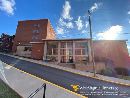 Eiesland Hall on the WVU downtown campus with the sun shining over the top of the building